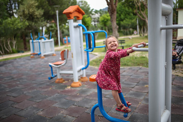 Outdoor exercise equipment, funny girl child play