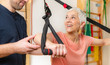© Microgen - Senior Woman Exercising on TRX