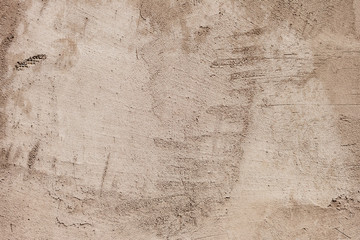 Texture of a concrete wall with cracks and scratches which can be used as a background