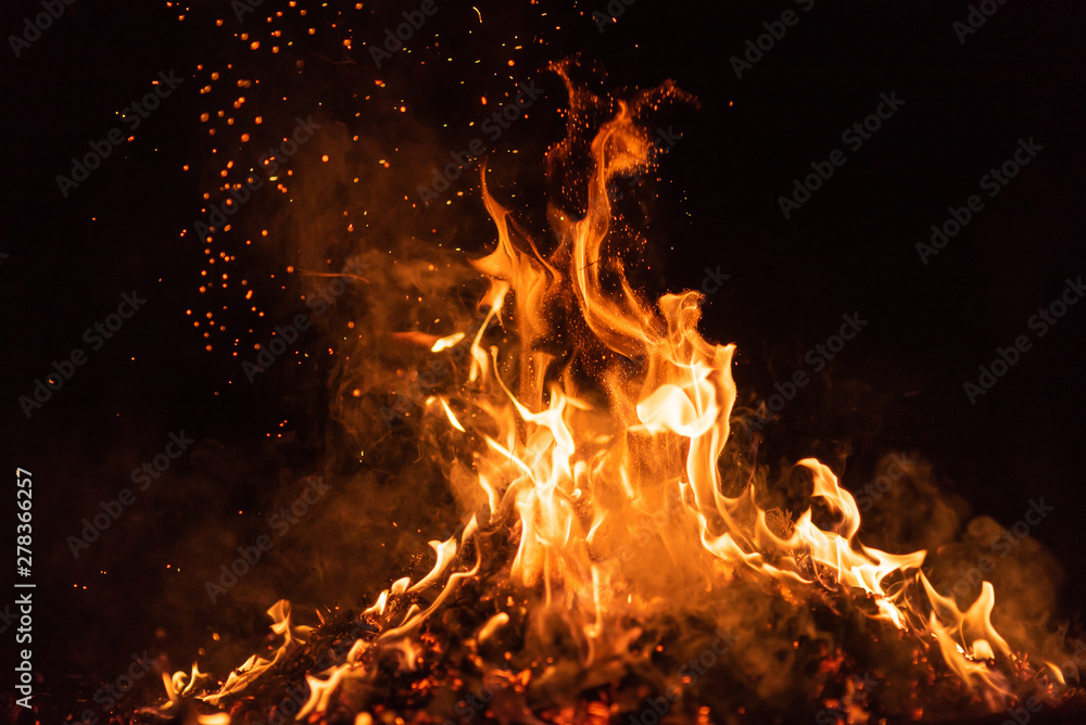 fire flames with sparks on black background - obrazy, fototapety, plakaty 