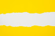 © aga7ta - pieces of yellow paper on white background with copy space