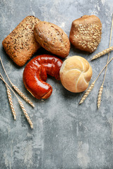 Sticker - Assorted buns on grey stone background.