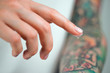 © Artem Markin - Fingers apply cream to skin. Close up
