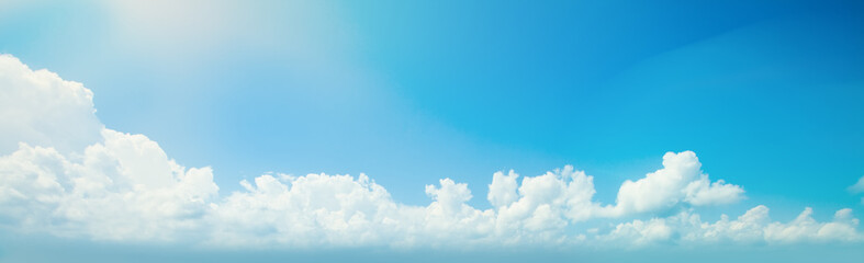 Wall Mural - blue sky clouds background. beautiful landscape with clouds and sun