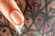 © Artem Markin - Fingers apply cream to skin. Close up