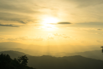 Wall Mural - the longitudinal mountains and the setting sun and the forest on doi tung