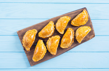 Wall Mural - Latin American baked beef empanadas with sauce