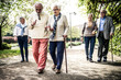 © oneinchpunch - Group of old people walking outdoor