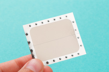 non smoking supplement, nicotine patch on blue background .