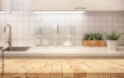 Fotomural Wood table top on blur kitchen counter (room)background.