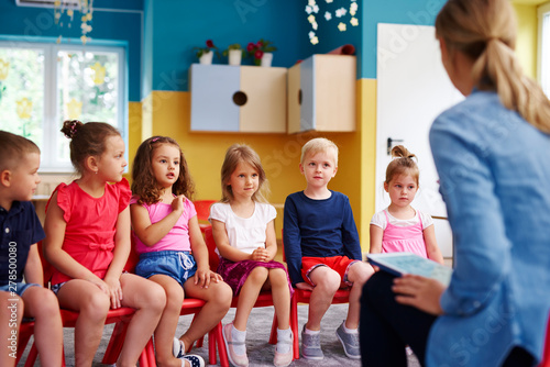 Group of children and teacher  in the preschool Canvas Print