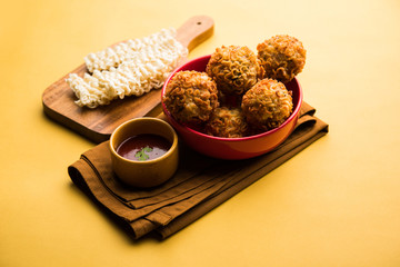 Crispy Noodles/maggie Pakora or pakoda is a popular indochinese street food served with ketchup