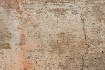 Texture of a concrete wall with cracks and scratches which can be used as a background