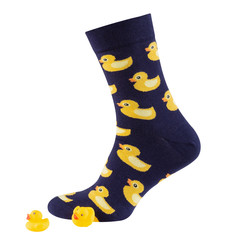 volumetric blue sock with prints of yellow ducklings, near two rubber ducklings, concept, on a white background