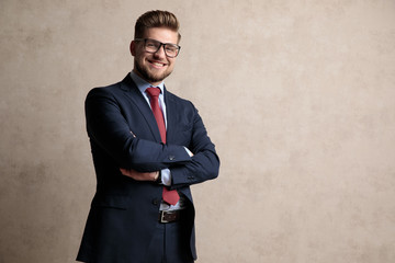 Poster - Handsome businessman smiling with his hands folded