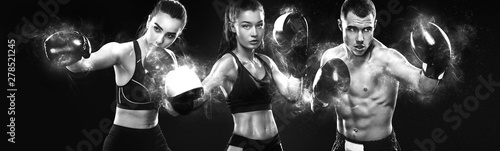 Group of three sportsmans, women and man boxers fighting in gloves on black background Fototapet