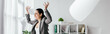 © LIGHTFIELD STUDIOS - panoramic shot of irritated pregnant woman throwing papers in air while standing near table in office