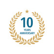 © serkorkin - 10 th years anniversary badge design with a laurel wreath. Ten years birthday logo emblem.