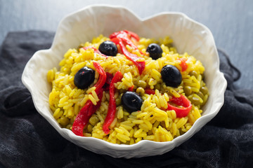 Poster - rice with vegetables and black olives in beautiful dish