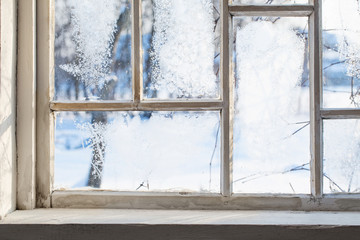 old wooden window with winter frost