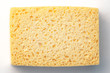 yellow pierced sponge on white and grey background