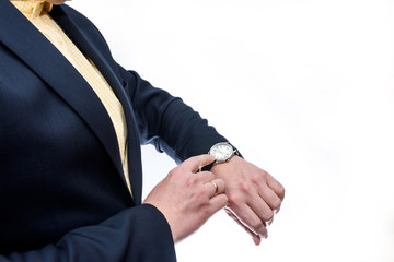 Businessman looking at clock on his hand is isolated on white background