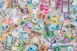 © RomanR - Mix of different banknotes, currency in all countries in world