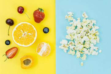 Top view pop corn vs fruit