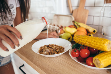 Woman cooking food breakfast in the kitchen.