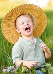 portrait of little BOY outdoors in summer