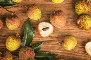 Poster - Fresh lychees on a wooden board background