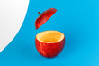 Health Red Cut Apple floating top slice juice drink idea concept on blue white background