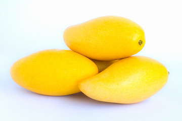 Wall Mural - ripe mangos on white background