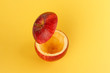 Healthy Red Cut Apple floating top slice juice drink idea concept on yellow background
