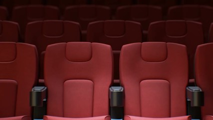 Wall Mural - Flashing Light from the Cinema Screen on the Red Chairs in Cinema Hall Seamless. Looped 3d Animation of Rows of Red Seats in Cinema. Art and Media Concept. 4k Ultra HD 3840x2160.
