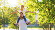 © JenkoAtaman - concept of father's day! happy family dad and child daughter    in nature