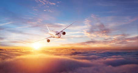 Wall Mural - passengers commercial airplane flying above clouds