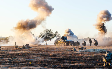 Explosions of bombs and shells. Reconstruction of the battle of world war II. Battle for Sevastopol. Reconstruction of the battle with explosions. Tanks and soldiers during the battle.