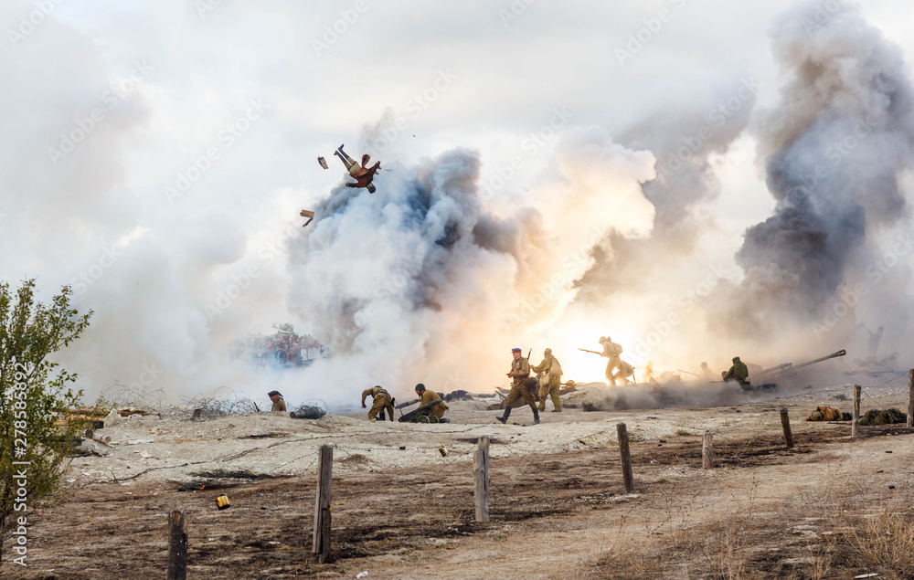 Explosions of bombs and shells. Reconstruction of the battle of world war II. Battle for Sevastopol. Reconstruction of the battle with explosions. Tanks and soldiers during the battle. - obrazy, fototapety, plakaty 