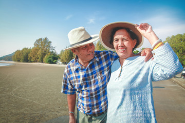 Wall Mural - Happy two elderly couples come to the sea