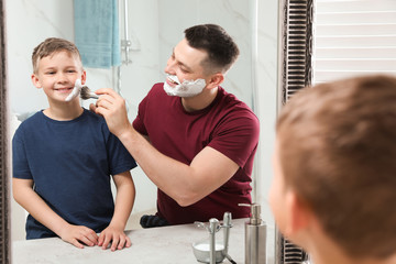 Sticker - Dad applying shaving foam on son's face at mirror in bathroom