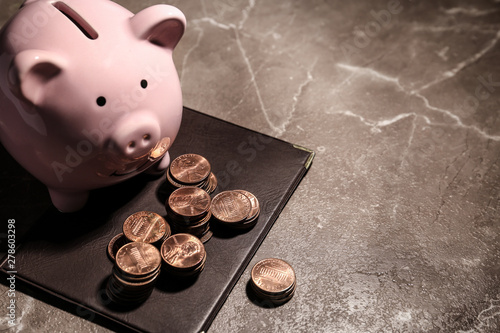 Fotografía Pension certificate, American coins and piggy bank on marble table, space for te