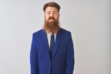 Poster - Young redhead irish businessman wearing suit standing over isolated white background puffing cheeks with funny face. Mouth inflated with air, crazy expression.