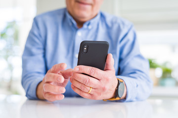 Sticker - Close up of man hands using smartphone and smiling confident