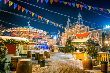 Wall Mural - Moscow, Russia. Decorations Red Square in the New Year. Christmas fair in Moscow. Carousel on Red Square in Christmas. Illumination on buildings Moscow in the New Year.