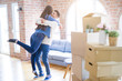 © Krakenimages.com - Beautiful young asian couple hugging in love, smiling happy and very excited for moving to a new home