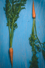 Wall Mural - Fresh tasty carrots on a wooden rustic table. Healthy food. Vegetables.