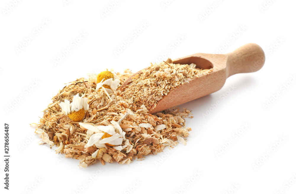 Scoop with dried chamomile flowers on white background