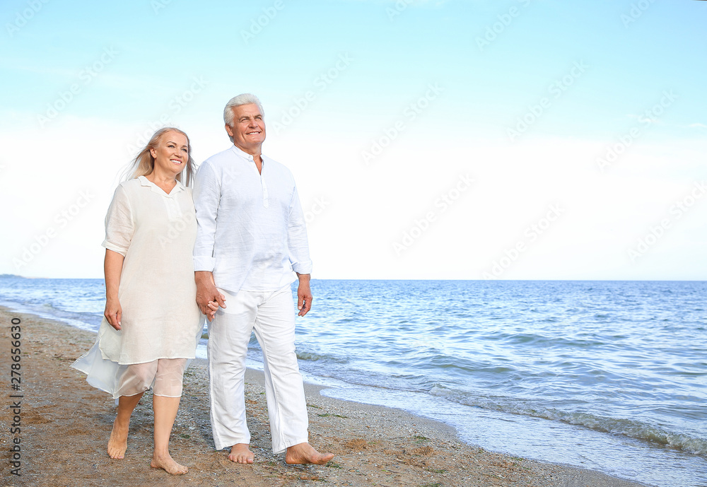 Happy mature couple at sea resort