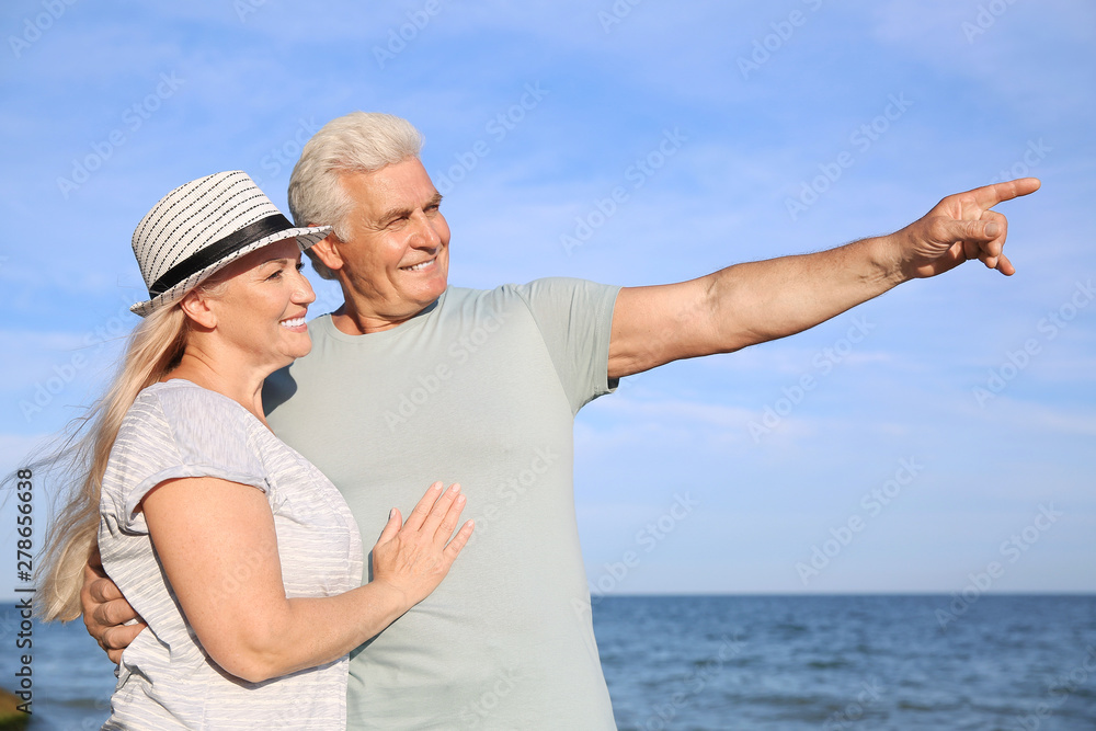 Happy mature couple at sea resort